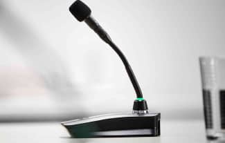 A black conferencing microphone.