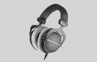 A pair of black and grey over-ear, close-back headphones.
