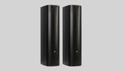 Two black column speakers standing next to each other.